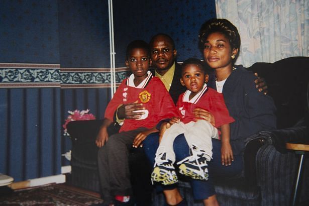 A picture of young Aaron (sitting on his mum's lap) wearing Man Utd red has been doing the rounds recently